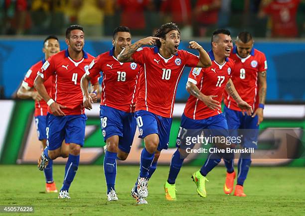 Jorge Valdivia of Chile celebrates scoring the team's second goal with teammates during the 2014 FIFA World Cup Brazil Group B match between Chile...