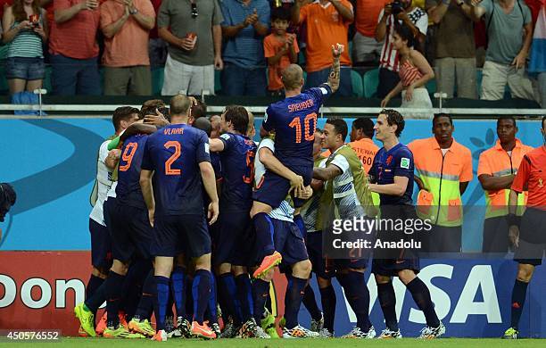 Arjen Robben and his teammates of Netherlands react after scoring a goal during the 2014 FIFA World Cup Brazil Group B match between Spain and...