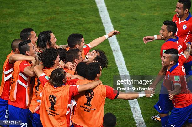 Jorge Valdivia of Chile celebrates scoring the team's second goal on the sidelines during the 2014 FIFA World Cup Brazil Group B match between Chile...