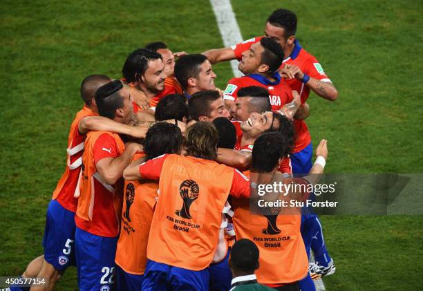 Jorge Valdivia of Chile celebrates scoring the team's second goal on the sidelines during the 2014 FIFA World Cup Brazil Group B match between Chile...