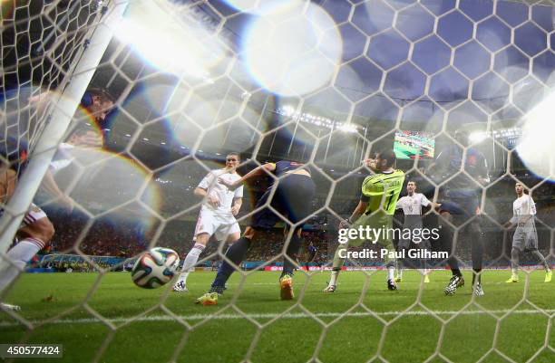 Stefan de Vrij of the Netherlands shoots and scores the team's third goal against Iker Casillas of Spain during the 2014 FIFA World Cup Brazil Group...