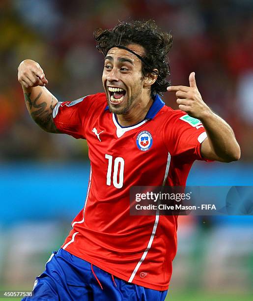 Jorge Valdivia of Chile celebrates with team-mates after scoring a goal during the 2014 FIFA World Cup Brazil Group B match between Chile and...