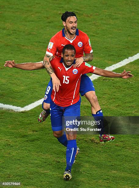 Mauricio Pinilla of Chile celebrates his team's third goal scored by Jean Beausejour during the 2014 FIFA World Cup Brazil Group B match between...