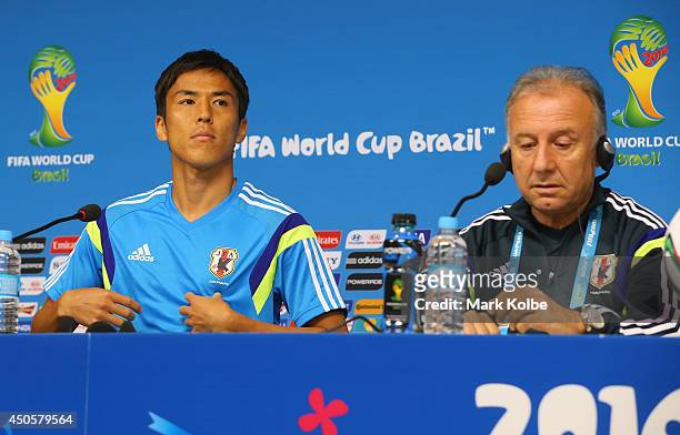 Japan captain Makoto Hasebe and head coach Alberto Zaccheroni listen to questions as they speak to the media during a press conference at Arena...