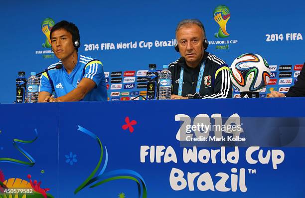 Japan captain Makoto Hasebe and head coach Alberto Zaccheroni listen to questions as they speak to the media during a press conference at Arena...