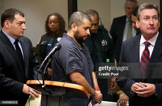 George Zimmerman, the acquitted shooter in the death of Trayvon Martin, leaves Courtroom J2 with his defense counsel Daniel Megaro and Jeff Dowdy...