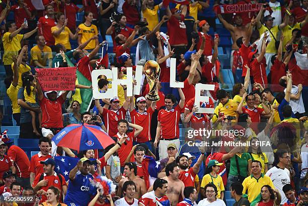 Chile fans celebrate after the 2014 FIFA World Cup Brazil Group B match between Chile and Australia at Arena Pantanal on June 13, 2014 in Cuiaba,...