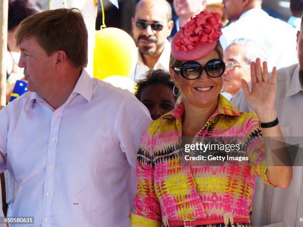 King Willem-Alexander of the Netherlands and Queen Maxima of the Netherlands during a visit to the fishing pier at West Point on November 19, 2013 in...