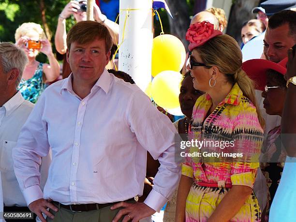 King Willem-Alexander of the Netherlands and Queen Maxima of the Netherlands during a visit to the fishing pier at West Point on November 19, 2013 in...