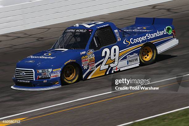 Ryan Blaney drives the Cooper Standard Ford during practice for the NASCAR Camping World Truck Series Drivin' For Lineman 200 at Gateway Motorsports...