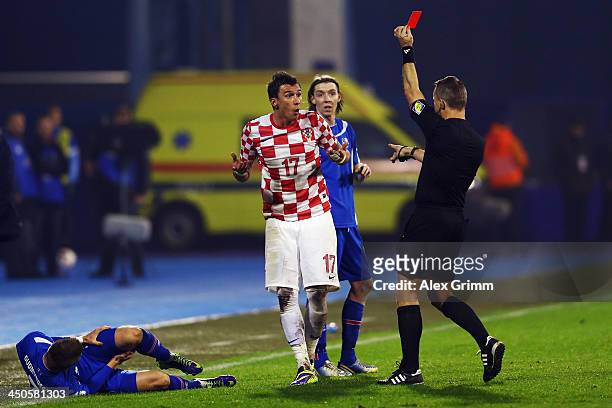 Mario Mandzukic of Croatia is sent off by referee Bjoern Kuipers during the FIFA 2014 World Cup Qualifier play-off second leg match between Croatia...