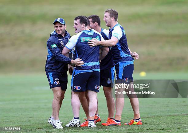 Robbie Farah, Paul Gallen and Ryan Hoffman group together during a New South Wales State of Origin training session at Novotel Coffs Harbour on June...