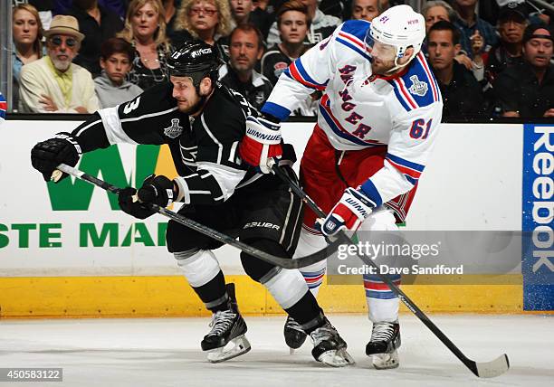 Rick Nash of the New York Rangers pressures Kyle Clifford of the Los Angeles Kings in the second period of Game Five of the 2014 Stanley Cup Final at...