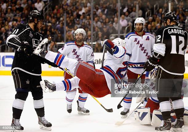 Dominic Moore of the New York Rangers gets upended in front of Anze Kopitar of the Los Angeles Kings during the second period of Game Five of the...