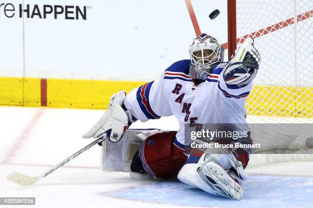 Goaltender Henrik Lundqvist of the New York Rangers makes a save against the Los Angeles Kings in the third period during Game Five of the 2014...