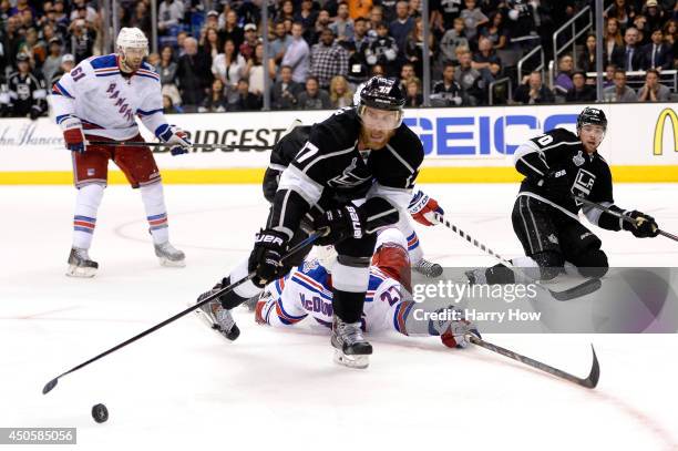 Jeff Carter of the Los Angeles Kings goes for the puck against Ryan McDonagh of the New York Rangers in overtime during Game Five of the 2014 Stanley...