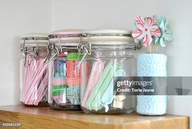 kitchen shelf with pretty pastel jars - forma de queque imagens e fotografias de stock