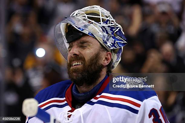 Henrik Lundqvist of the New York Rangers reacts after giving up the game-winning goal to Alec Martinez of the Los Angeles Kings in double overtime...