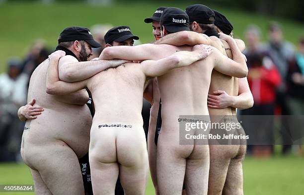 The New Zealand Nude Blacks have a team huddle during the Naked Rugby match between New Zealand and England at University Oval on June 14, 2014 in...