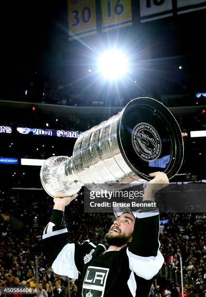 Alec Martinez of the Los Angeles Kings celebrates with the Stanley Cup after the Kings 3-2 double overtime victory against the New York Rangers in...