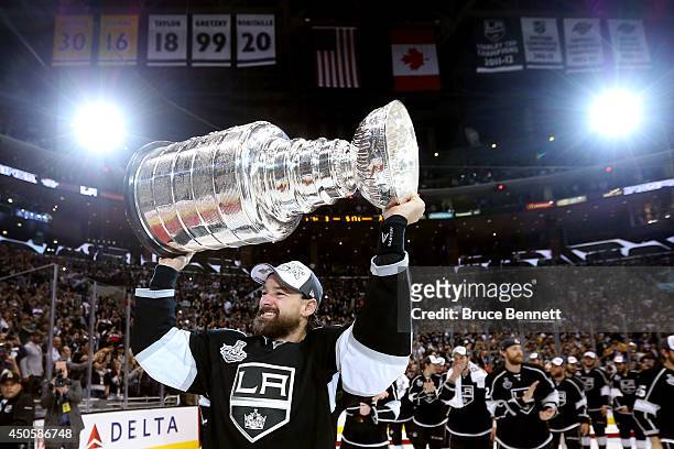 Justin Williams of the Los Angeles Kings celebrates with the Stanley Cup after the Kings 3-2 double overtime victory against the New York Rangers in...