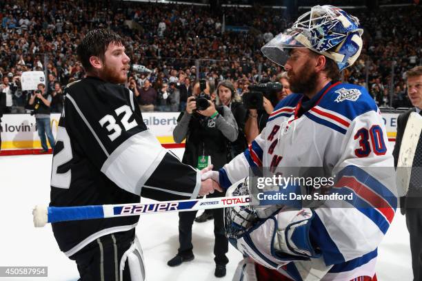 Goaltender Jonathan Quick of the Los Angeles Kings shakes hands with goaltender Henrik Lundqvist of the New York Rangers after the Kings defeated the...