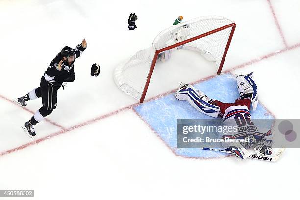 Alec Martinez of the Los Angeles Kings celebrates after he scores the game-winning goal in double overtime against goaltender Henrik Lundqvist of the...