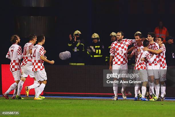 Mario Mandzukic of Croatia celebrates his team's first goal with team mates during the FIFA 2014 World Cup Qualifier play-off second leg match...