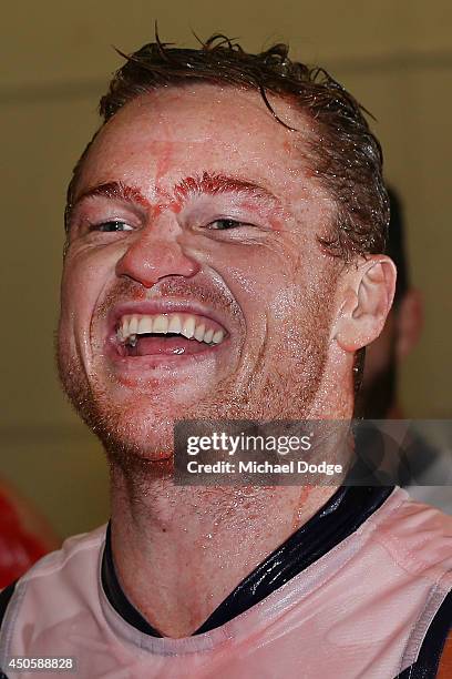 Colin Sylvia of the Dockers sings the song after his first win with the club during the round 13 AFL match between the Richmond Tigers and the...