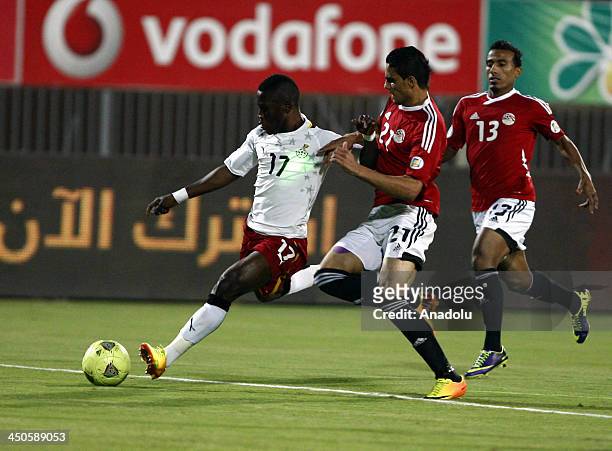 Ghanaian Rashid Sumaila and Egyptian Mohamed Naguib vie for the ball during the FIFA World Cup 2014 African zone football qualifier second leg...