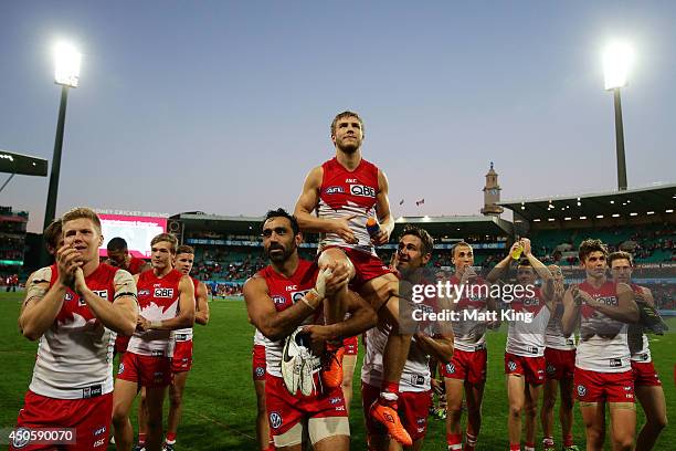 Kieren Jack of the Swans is chaired off the field during the round 13 AFL match between the Sydney Swans and the Port Adelaide Power at Sydney...