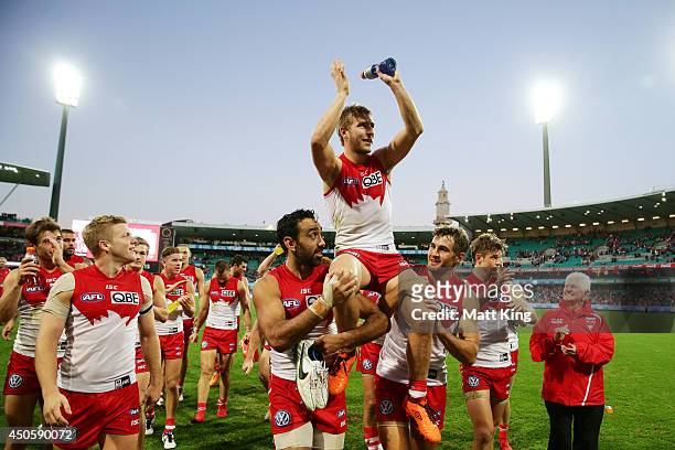 Kieren Jack of the Swans is chaired off the field during the round 13 AFL match between the Sydney Swans and the Port Adelaide Power at Sydney...