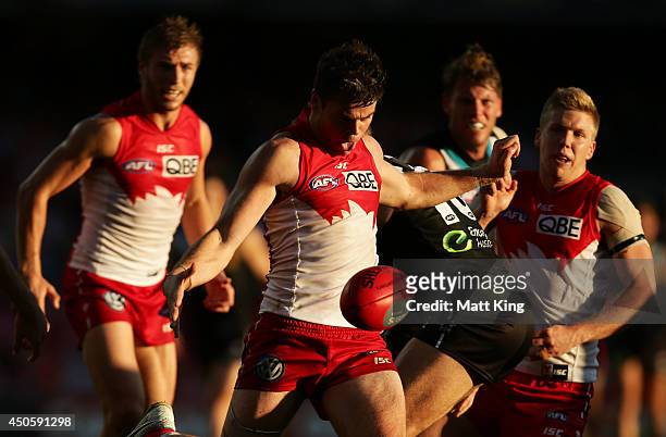 Craig Bird of the Swans kicks upfield during the round 13 AFL match between the Sydney Swans and the Port Adelaide Power at Sydney Cricket Ground on...