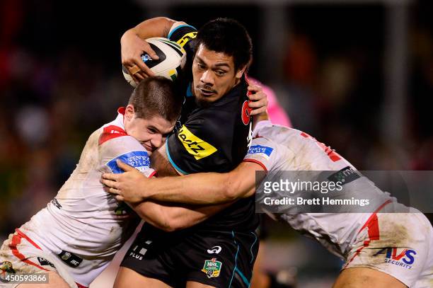 Sika Manu of the Panthers is tackled during the round 14 NRL match between the Penrith Panthers and the St George Illawarra Dragons at Sportingbet...