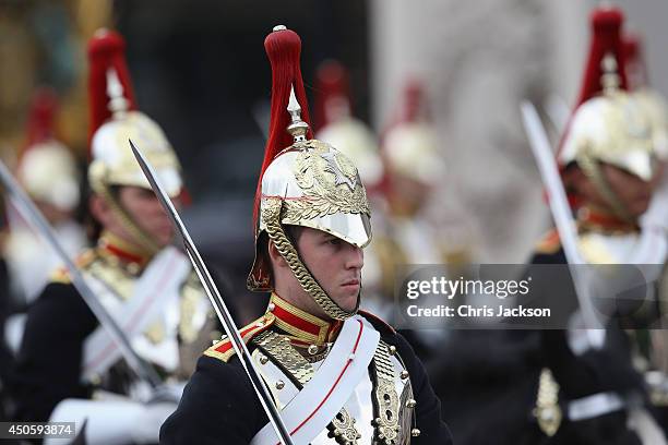 Members of the Household Cavalry passes prior to the Trooping the Colour - Queen Elizabeth II's Birthday Parade, at The Royal Horseguards on June 14,...