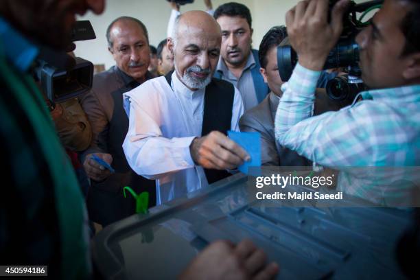Afghan presidential candidate Ashraf Ghani casts his vote at a polling station on June 14, 2014 in in Kabul, Afghanistan. Polling stations have...