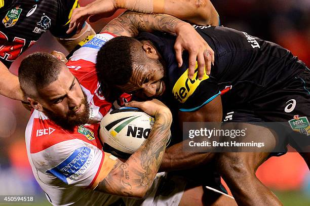 Joel Thompson of the Dragons is tackled during the round 14 NRL match between the Penrith Panthers and the St George Illawarra Dragons at Sportingbet...