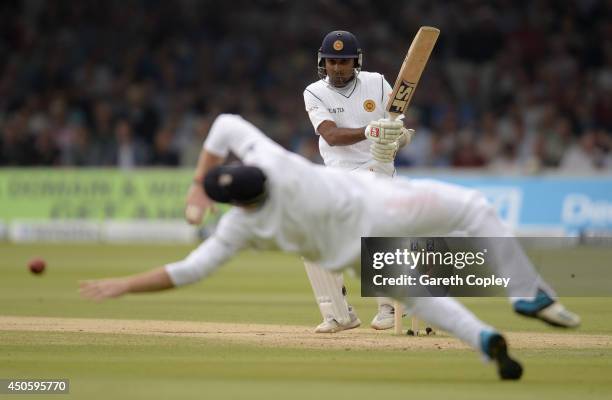 Mahela Jayawardena of Sri Lanka hits past Ian Bell of England during day three of 1st Investec Test match between England and Sri Lanka at Lord's...