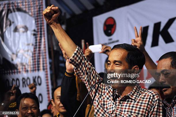 Indonesian frontrunner and presidential candidate Jakarta Governor Joko Widodo addresses supporters during a campaign rally in his hometown Solo...