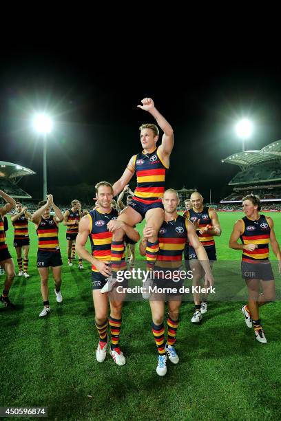 Brent Reilly of the Crows is chaired from the field after his 200th game after the round 13 AFL match between the Adelaide Crows and the North...