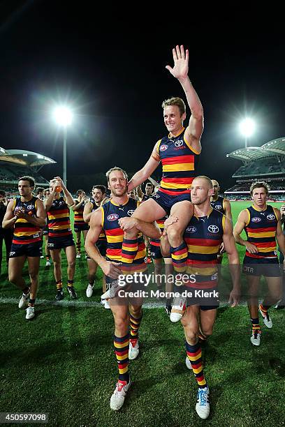 Brent Reilly of the Crows is chaired from the field after his 200th game after the round 13 AFL match between the Adelaide Crows and the North...