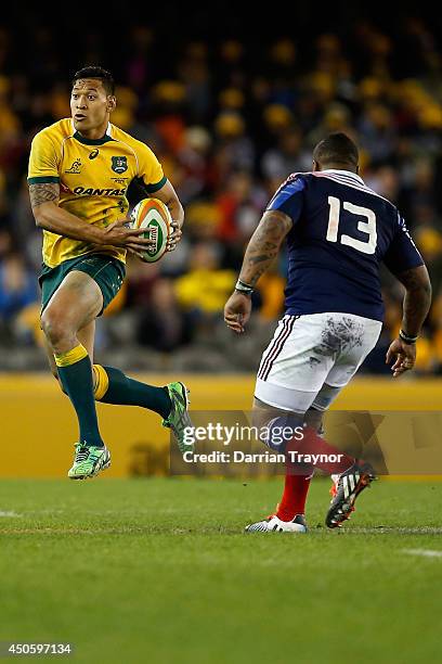 Isreal Folau of the Wallabies evades Mathieu Bastareaud of France during the second International Test Match between the Australian Wallabies and...