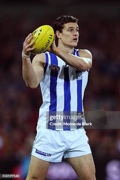 Scott Thompson of the Kangaroos wins the ball during the round 13 AFL match between the Adelaide Crows and the North Melbourne Kangaroos at Adelaide...