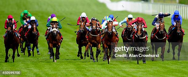 Jamie Spencer riding Wind Fire win The Betfred 'Hat Trick Heaven' Scurry Stakes at Sandown racecourse on June 14, 2014 in Esher, England.