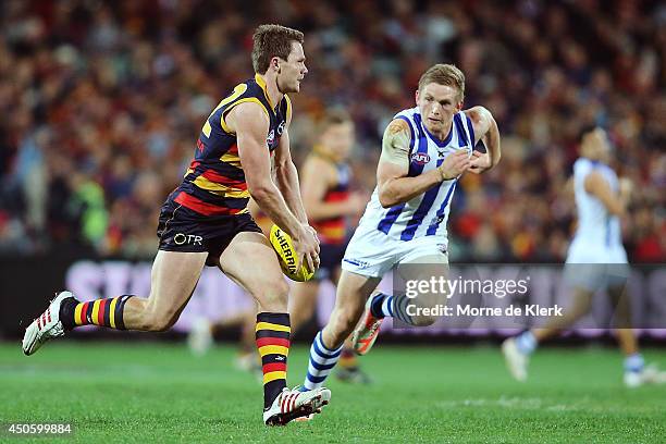 Patrick Dangerfield of the Crows gets away from Jack Ziebell of the Kangaroos during the round 13 AFL match between the Adelaide Crows and the North...