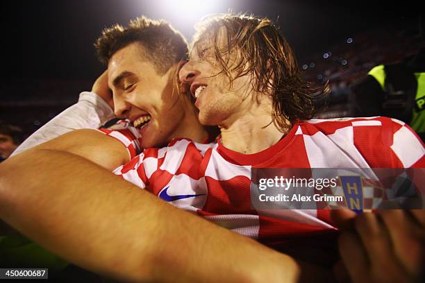 Luka Modric of Croatia celebrates with team mate Mateo Kovacic after the FIFA 2014 World Cup Qualifier play-off second leg match between Croatia and...