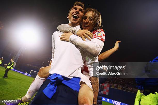 Mario Mandzukic of Croatia celebrates with team mate Luka Modric after the FIFA 2014 World Cup Qualifier play-off second leg match between Croatia...