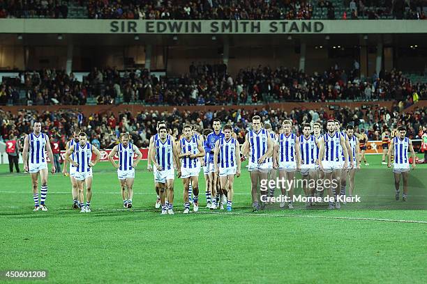 North Melbourne players leave the field after the round 13 AFL match between the Adelaide Crows and the North Melbourne Kangaroos at Adelaide Oval on...