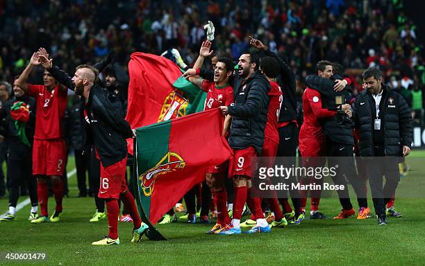 Raul Meireles and Hugo Almeida of Portugal celebrate after winning the FIFA 2014 World Cup Qualifier Play-off Second Leg match between Sweden and...