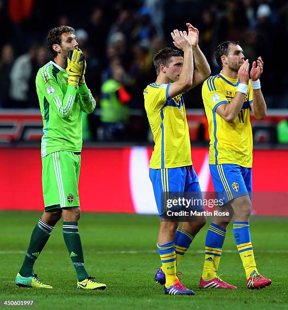 Andreas Isaksson, Anders Svensson and Johan Elmander of Sweden look dejected after losing the FIFA 2014 World Cup Qualifier Play-off Second Leg match...